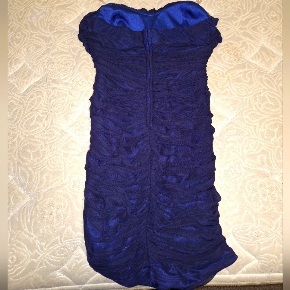 A Speechless sleeveless blue ruching formal dress. It's a size medium.